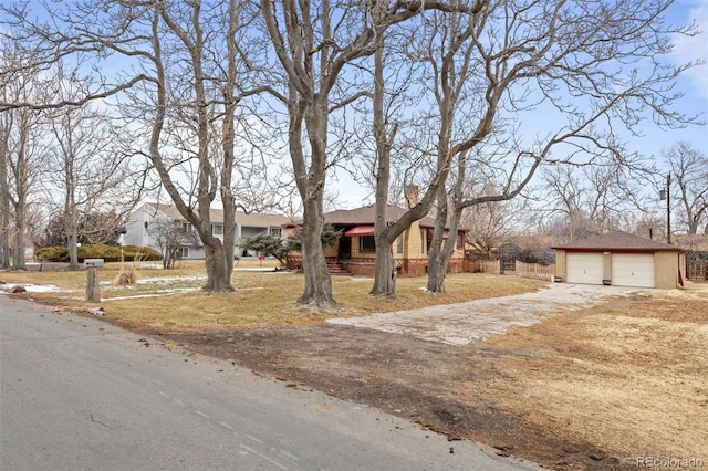 view of front of home featuring a garage, fence, and a residential view