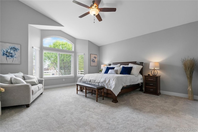 carpeted bedroom with high vaulted ceiling, baseboards, and a ceiling fan