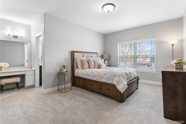 bedroom featuring light carpet and baseboards