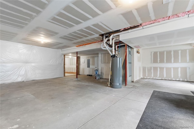 garage with water heater and electric panel