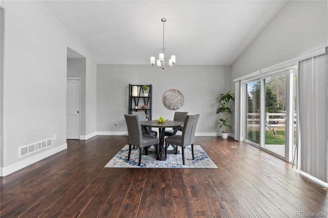 dining room with a notable chandelier, baseboards, visible vents, high vaulted ceiling, and hardwood / wood-style flooring