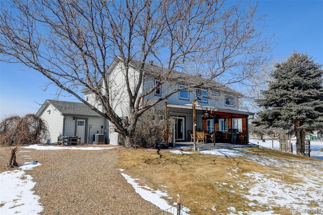 view of front of house with entry steps and central air condition unit