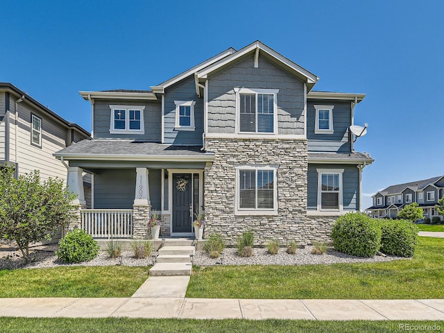 11902 Norfolk Ct, Commerce City, CO 80022 - view of front of property featuring a porch and stone siding