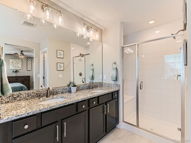 11902 Norfolk Ct, Commerce City, CO 80022 - ensuite bathroom featuring a stall shower, double vanity, a ceiling fan, and tile patterned floors
