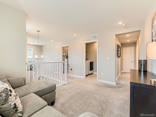 11902 Norfolk Ct, Commerce City, CO 80022 - living area featuring washer / clothes dryer, light carpet, a chandelier, and recessed lighting