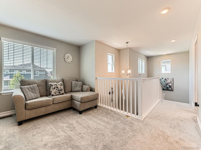 11902 Norfolk Ct, Commerce City, CO 80022 - carpeted living room featuring a chandelier and recessed lighting