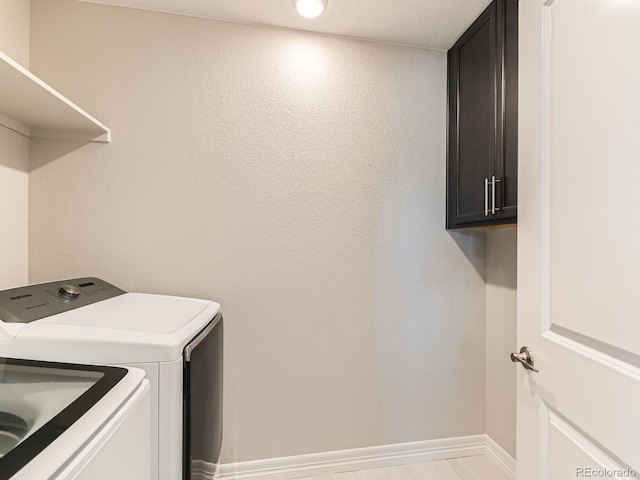 11902 Norfolk Ct, Commerce City, CO 80022 - laundry room featuring independent washer and dryer and cabinet space
