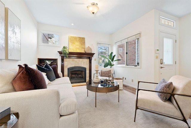 443 Garfield St, Denver, CO 80206 - living area featuring a tile fireplace, baseboards, and recessed lighting