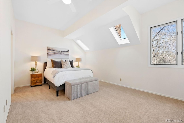 443 Garfield St, Denver, CO 80206 - carpeted bedroom featuring a skylight, baseboards, vaulted ceiling, and a ceiling fan