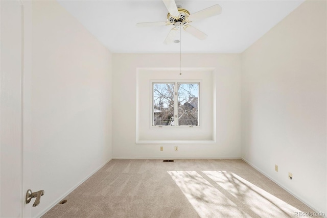 443 Garfield St, Denver, CO 80206 - empty room featuring light colored carpet, a ceiling fan, and baseboards