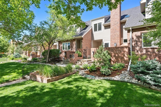 443 Garfield St, Denver, CO 80206 - rear view of property with brick siding, a lawn, a chimney, and roof with shingles
