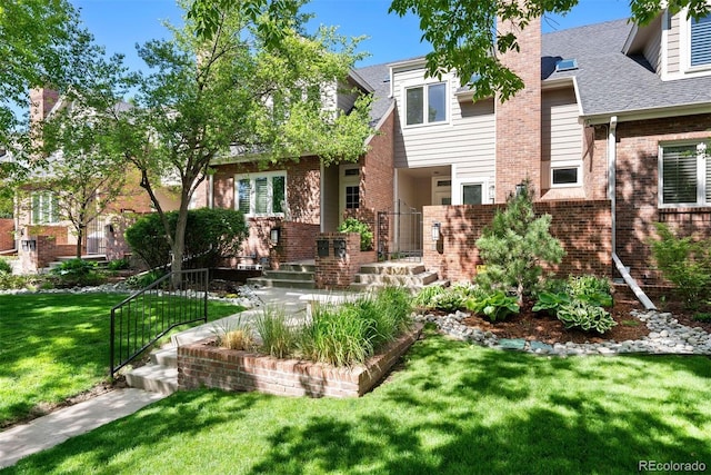 443 Garfield St, Denver, CO 80206 - view of front of house featuring brick siding, a front lawn, a chimney, and a shingled roof