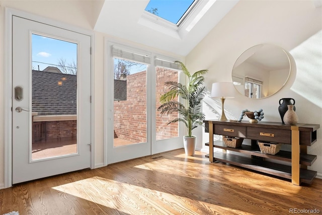 443 Garfield St, Denver, CO 80206 - entryway featuring a skylight, wood finished floors, and high vaulted ceiling