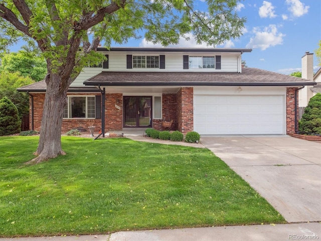 6898 W Nova Dr, Littleton, CO 80128 - traditional home with brick siding, driveway, and a front yard