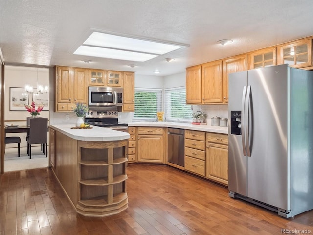 6898 W Nova Dr, Littleton, CO 80128 - kitchen with appliances with stainless steel finishes, open shelves, light countertops, dark wood-style floors, and a textured ceiling