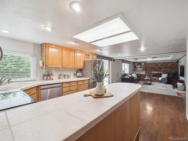 6898 W Nova Dr, Littleton, CO 80128 - kitchen with stainless steel appliances, a sink, healthy amount of natural light, dark wood-type flooring, and recessed lighting
