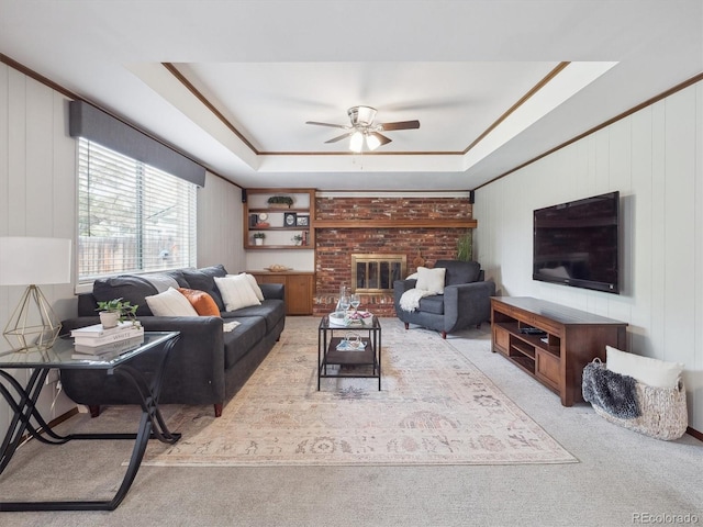 6898 W Nova Dr, Littleton, CO 80128 - living room featuring a raised ceiling, carpet, and ceiling fan