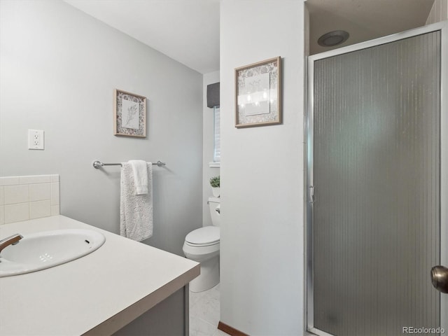6898 W Nova Dr, Littleton, CO 80128 - bathroom with vanity, a shower stall, and toilet