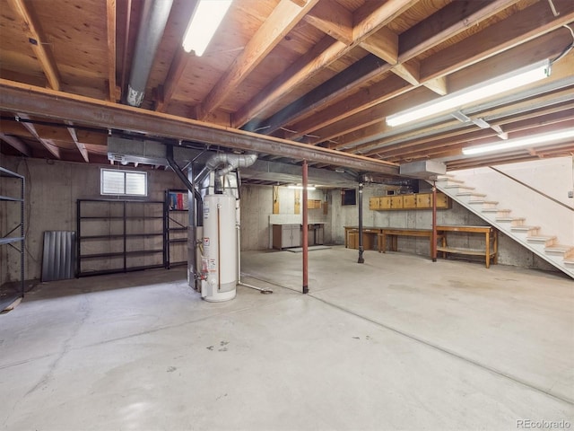 6898 W Nova Dr, Littleton, CO 80128 - below grade area featuring water heater and stairs