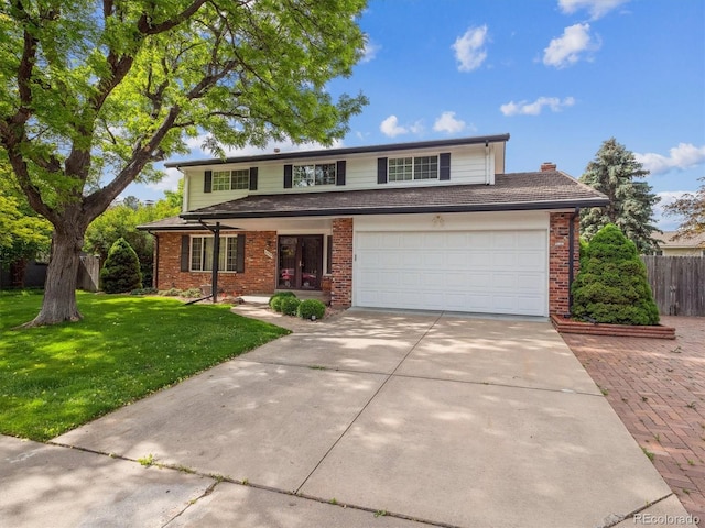 6898 W Nova Dr, Littleton, CO 80128 - traditional-style home featuring driveway, brick siding, and a garage