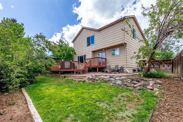 back of house with a wooden deck