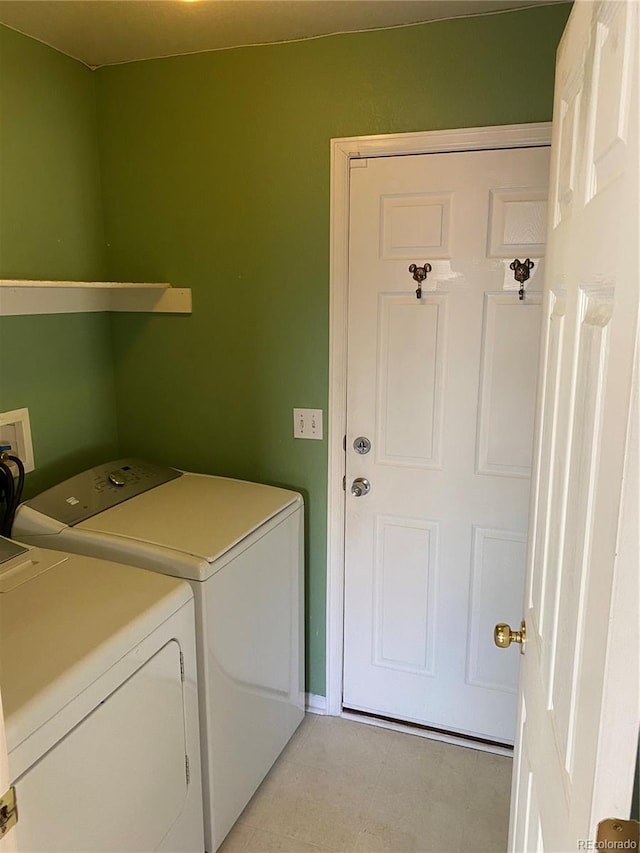 laundry area with laundry area and washing machine and clothes dryer