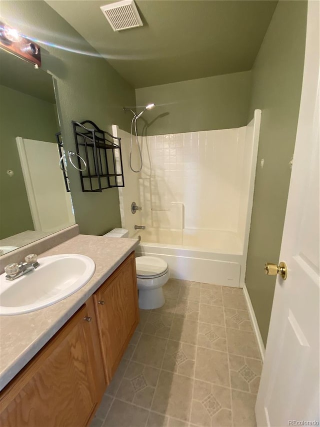 full bathroom with shower / bathing tub combination, visible vents, vanity, tile patterned floors, and toilet