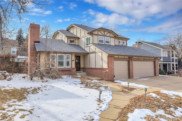 tudor house with brick siding, a chimney, a shingled roof, concrete driveway, and a garage