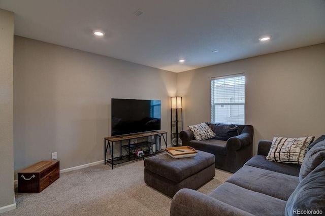 living area featuring carpet flooring, baseboards, and recessed lighting
