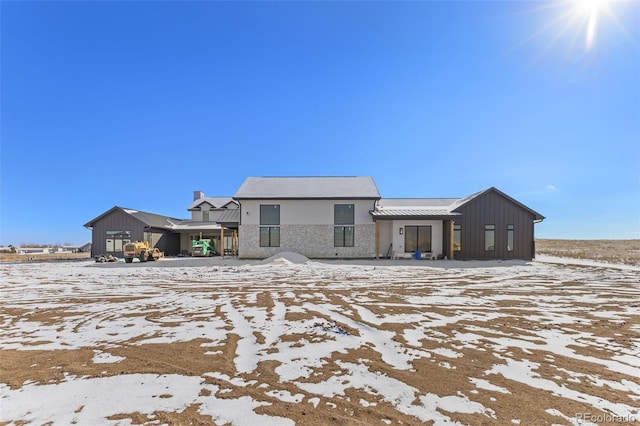 view of snow covered house