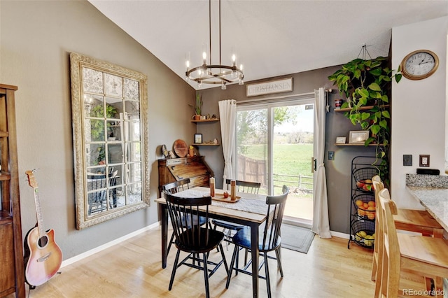 8680 Apache Plume Dr, Parker, CO 80134 - dining space featuring a chandelier, light wood-style floors, baseboards, and lofted ceiling