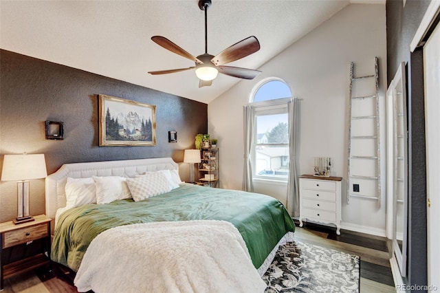 8680 Apache Plume Dr, Parker, CO 80134 - bedroom featuring vaulted ceiling, wood finished floors, a textured wall, and a ceiling fan