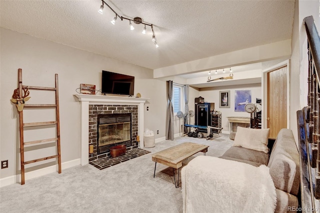 8680 Apache Plume Dr, Parker, CO 80134 - carpeted living area with a textured ceiling, rail lighting, a brick fireplace, and baseboards