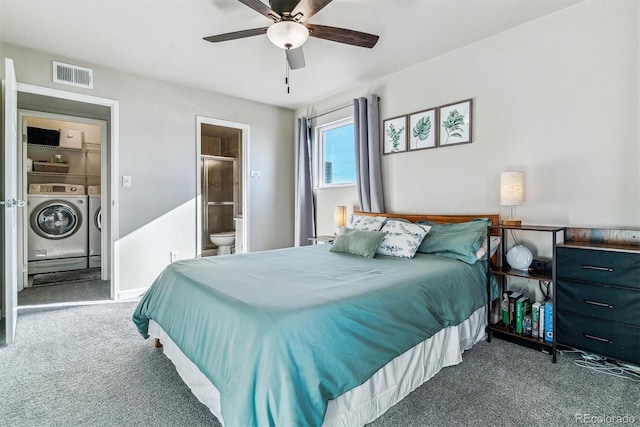 carpeted bedroom featuring ceiling fan, ensuite bathroom, and washer and clothes dryer