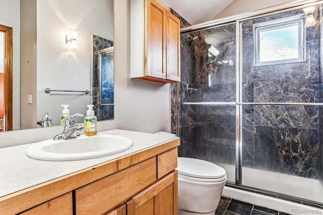 bathroom with walk in shower, tile patterned floors, lofted ceiling, toilet, and vanity