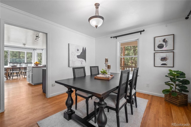 50 Victoria Rd, Pine, CO 80470 - dining room with crown molding, plenty of natural light, light wood finished floors, and baseboards