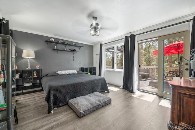 50 Victoria Rd, Pine, CO 80470 - bedroom featuring access to outside, wood finished floors, ornamental molding, and a ceiling fan