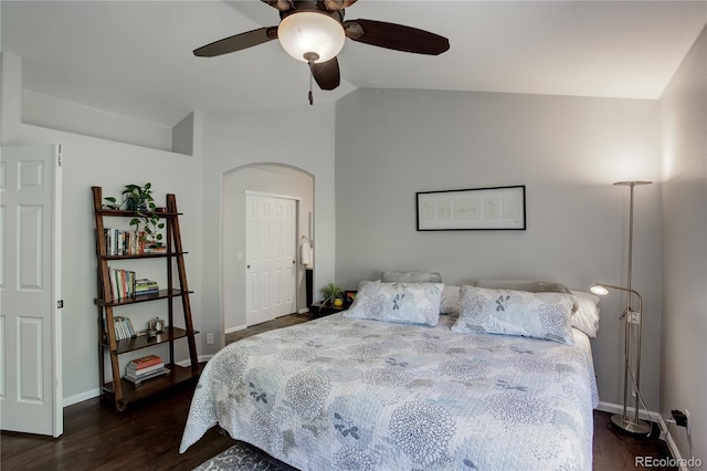 5757 W Alamo Dr, Denver, CO 80123 - bedroom featuring dark wood-type flooring, vaulted ceiling, baseboards, a ceiling fan, and arched walkways