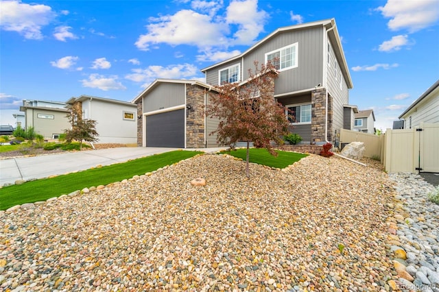 9869 Meridian Hills Trl, Peyton, CO 80831 - view of front of house featuring stone siding, concrete driveway, board and batten siding, and an attached garage