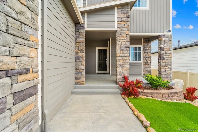 9869 Meridian Hills Trl, Peyton, CO 80831 - property entrance featuring stone siding and covered porch