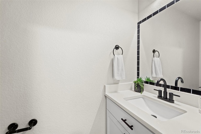 9869 Meridian Hills Trl, Peyton, CO 80831 - bathroom with vanity and a textured wall