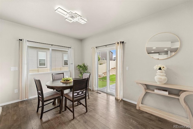 9869 Meridian Hills Trl, Peyton, CO 80831 - dining room featuring dark wood finished floors and healthy amount of natural light