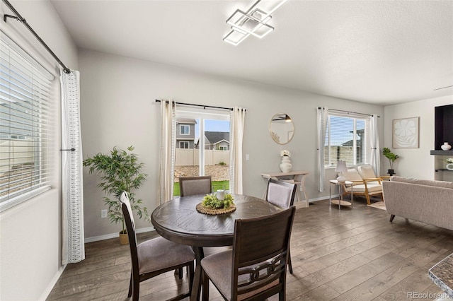 9869 Meridian Hills Trl, Peyton, CO 80831 - dining area with hardwood / wood-style floors and baseboards
