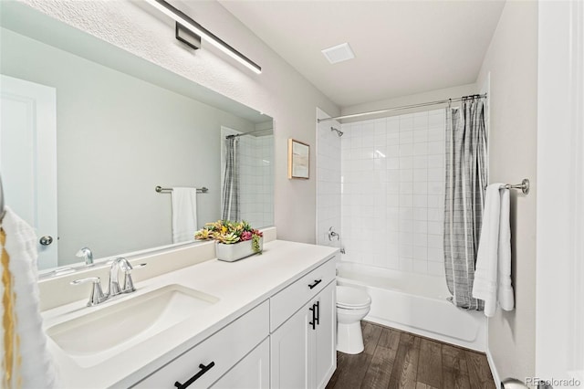 9869 Meridian Hills Trl, Peyton, CO 80831 - bathroom with vanity, wood finished floors, and shower / bath combo