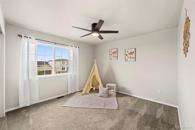9869 Meridian Hills Trl, Peyton, CO 80831 - recreation room featuring a ceiling fan and carpet flooring