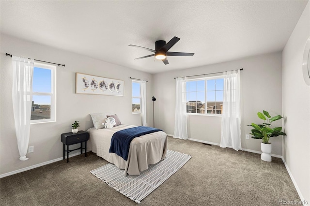 9869 Meridian Hills Trl, Peyton, CO 80831 - carpeted bedroom with baseboards and ceiling fan