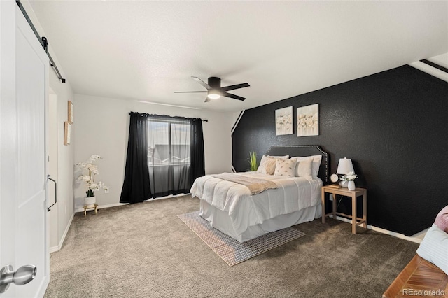 9869 Meridian Hills Trl, Peyton, CO 80831 - carpeted bedroom featuring ceiling fan and a barn door