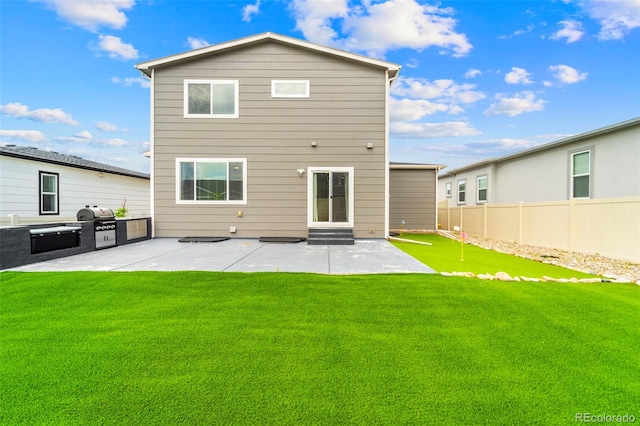 9869 Meridian Hills Trl, Peyton, CO 80831 - rear view of house with a patio, entry steps, and a putting green