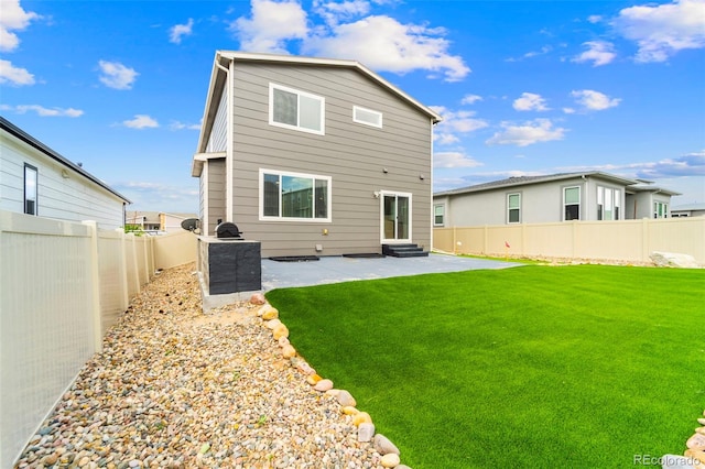 9869 Meridian Hills Trl, Peyton, CO 80831 - back of house featuring a patio, a fenced backyard, and entry steps