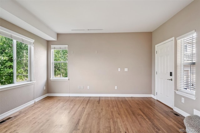 12921 Grant Cir Unit B, Thornton, CO 80241 - spare room featuring wood finished floors and baseboards